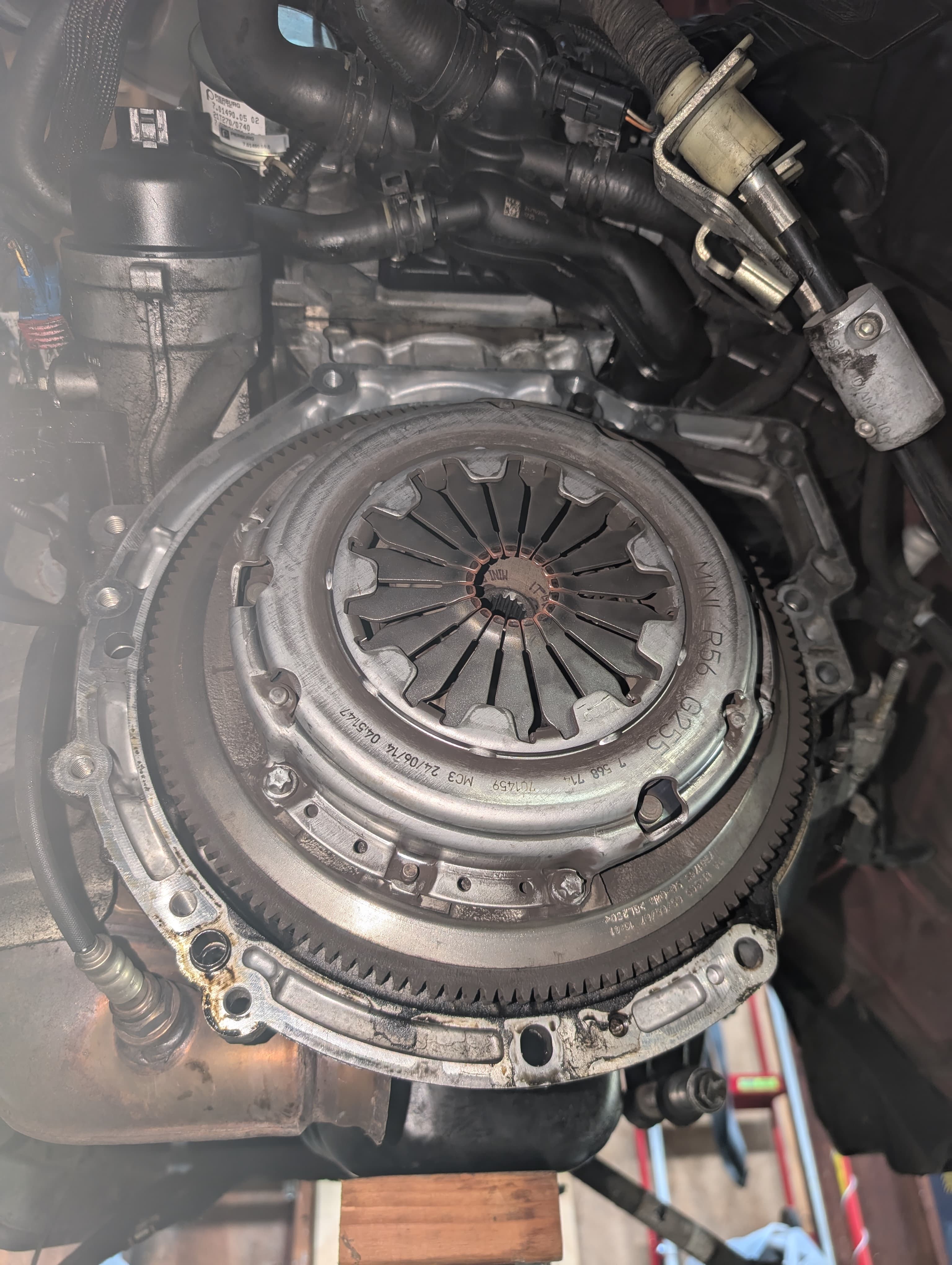 Clutch and flywheel assembly on the engine