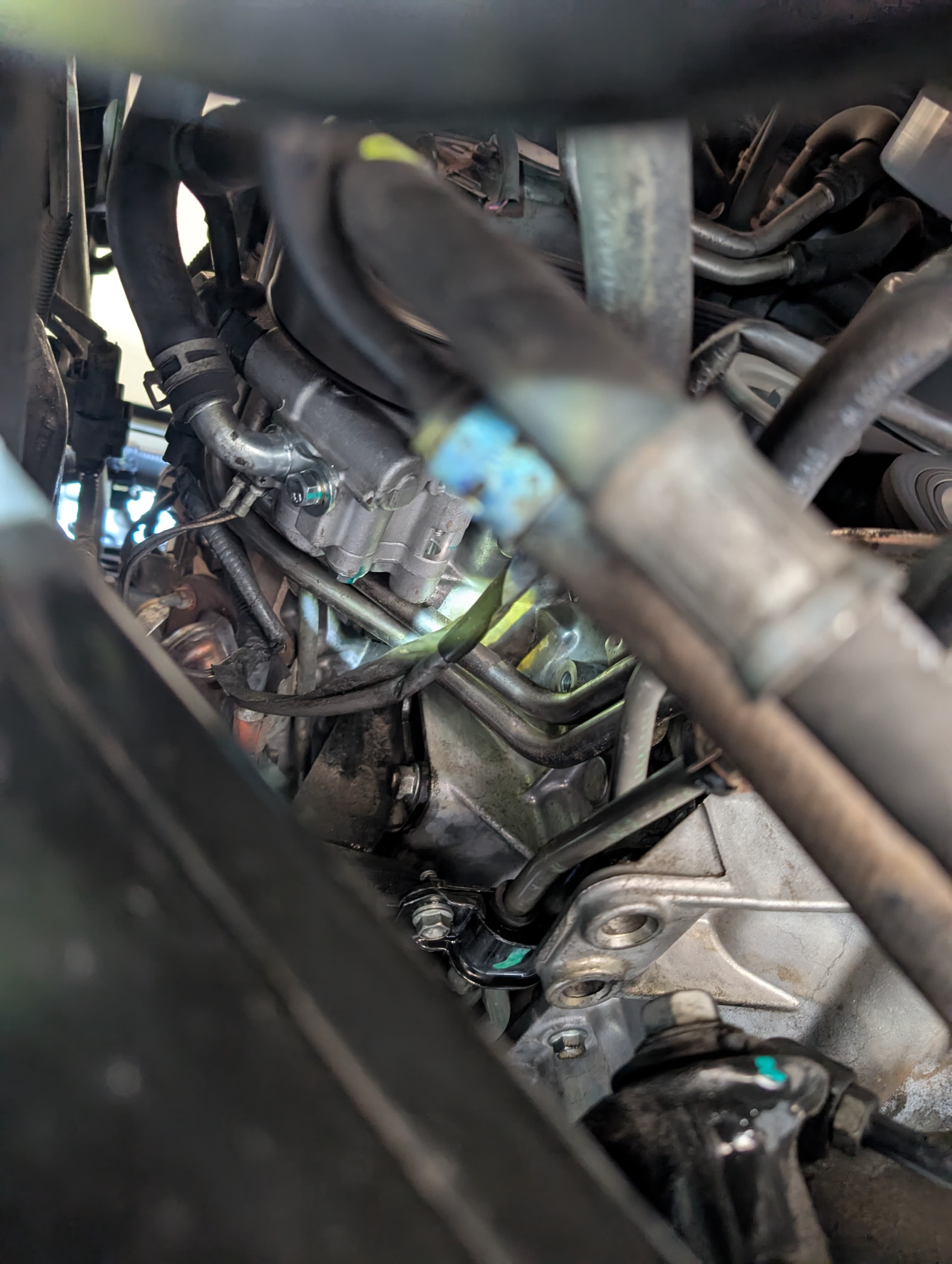 Engine bay close-up showing intake and wiring