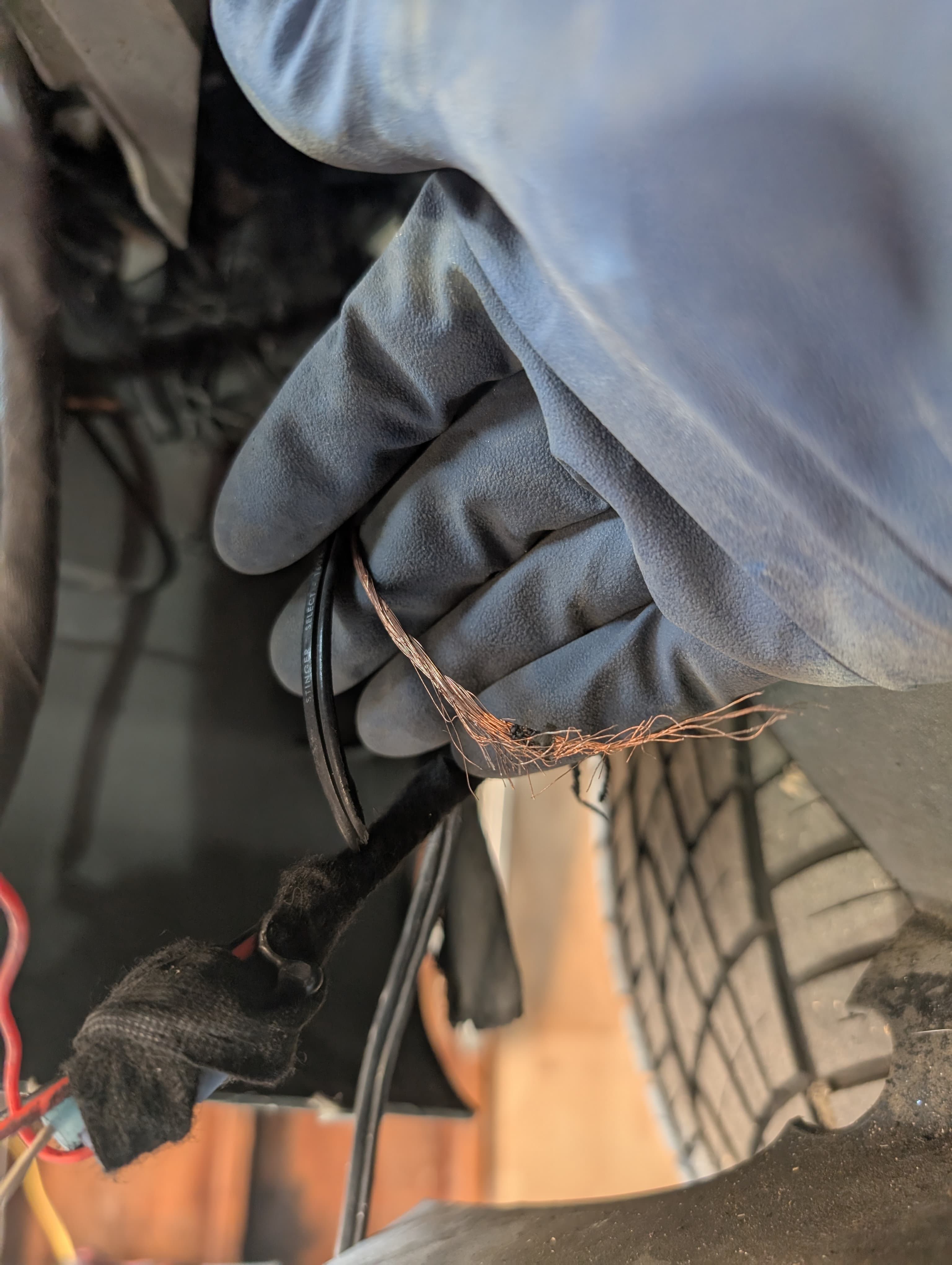 Frayed ground wire found during electrical inspection