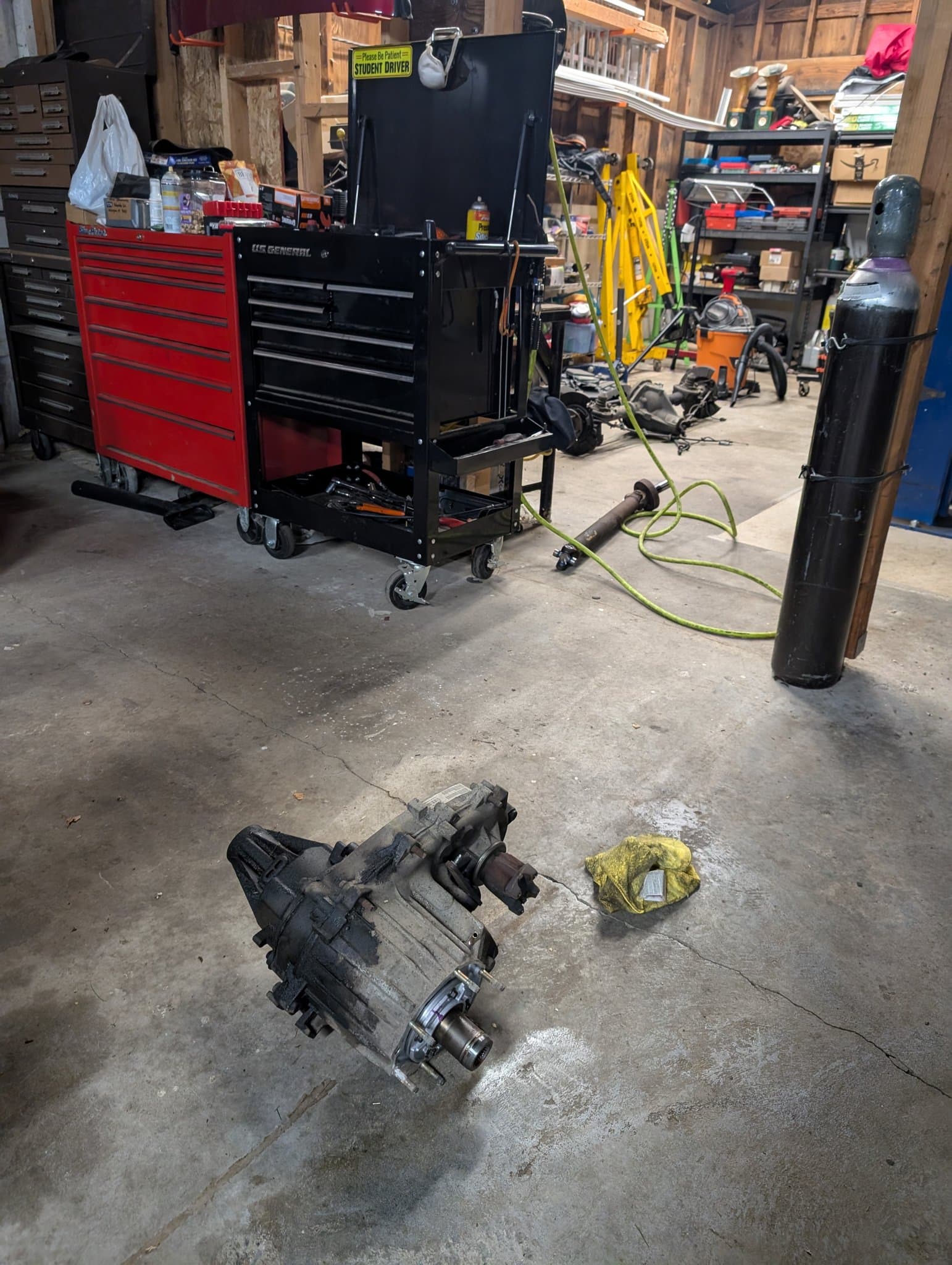 Shop floor with Snap-on toolbox, transfer case, and equipment